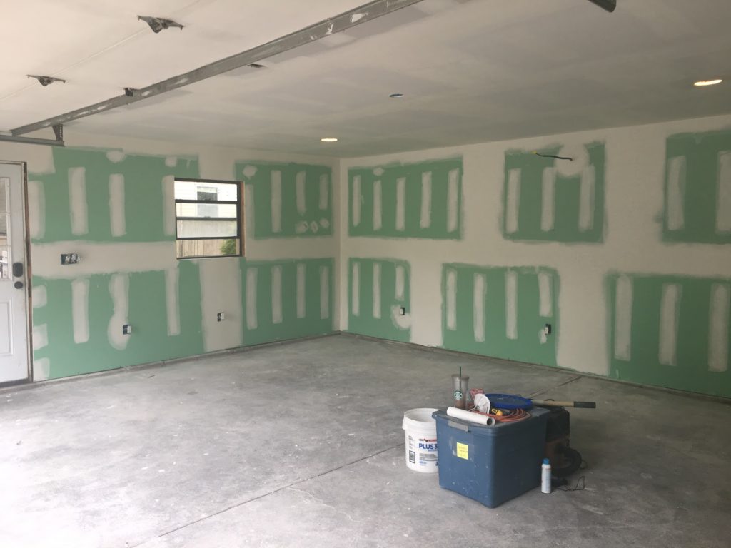the inside of a house with a wall that is ready for drywall 