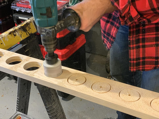 Hole saw cutting out circles in wood