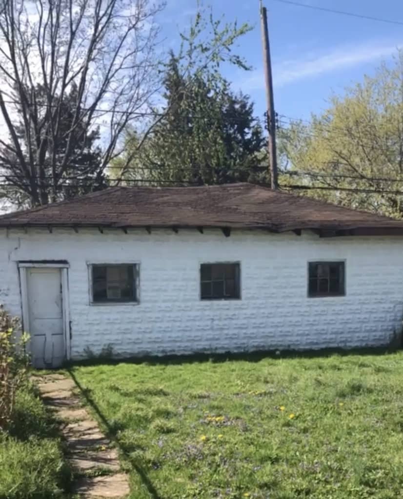 Old_Garage_In_The_Back_Of_A_House_Garage_Roof_Caving_In