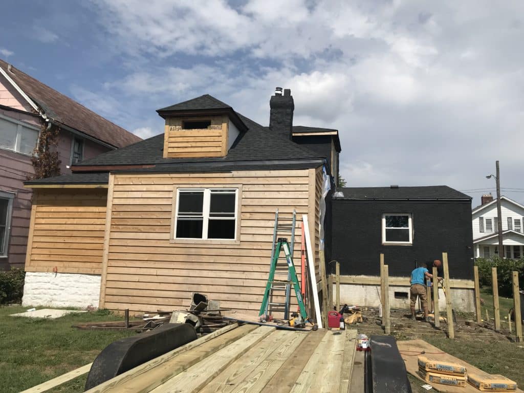 Stucco_Cedar_And_A_Painted_Black_House