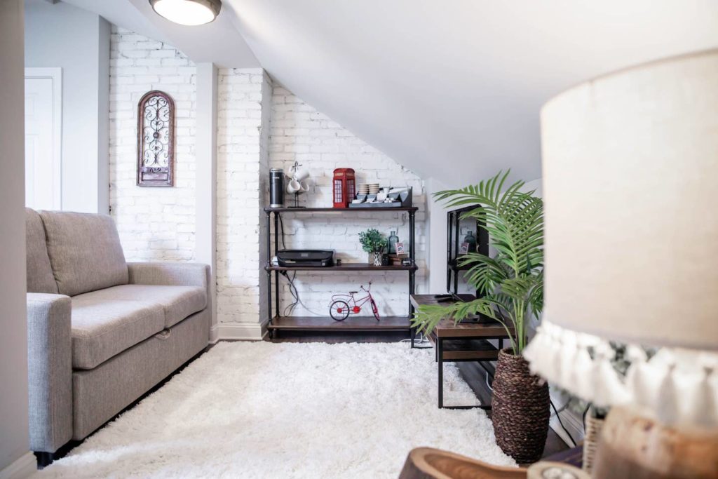 white_living_room_with_exposed_brick