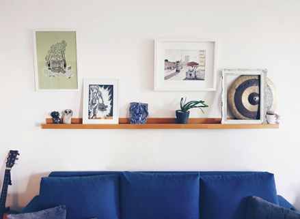 picture ledge with blue couch