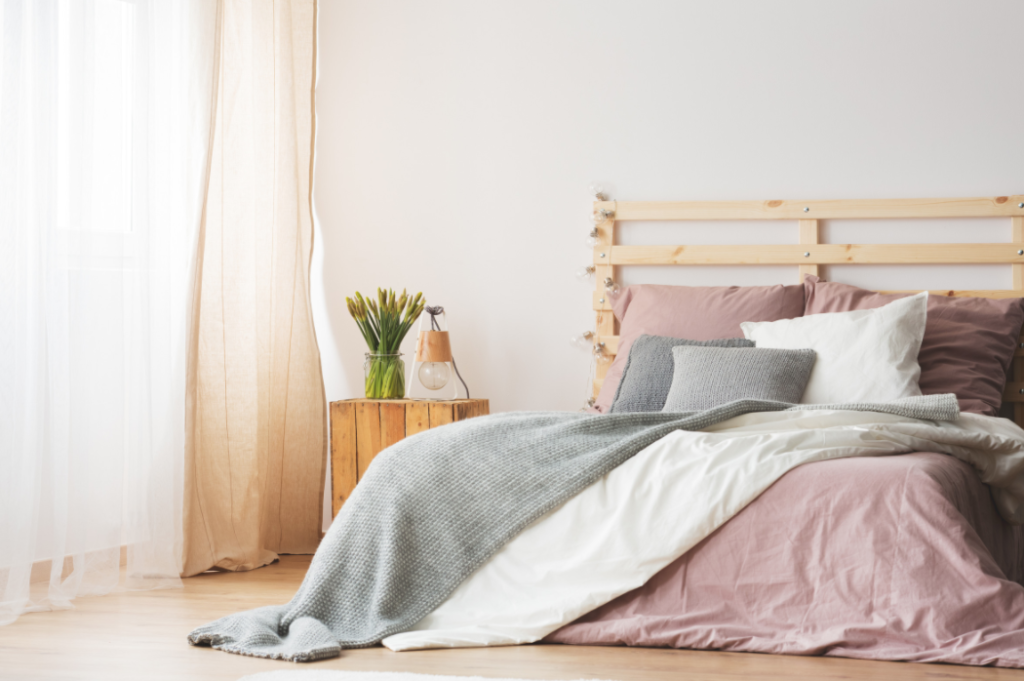 bedroom with a bed and a side table