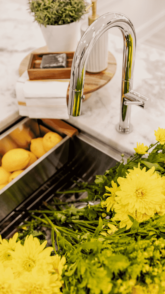 flowers and lemons in a contemporary sink