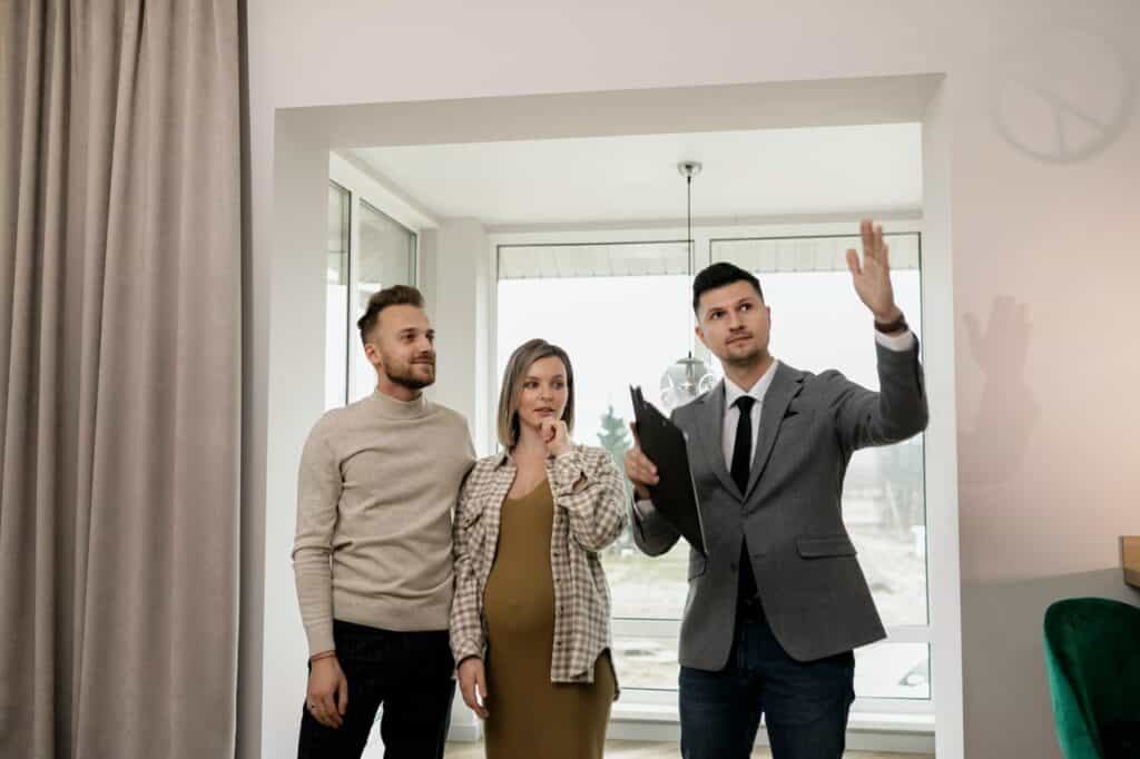 Real Estate Agent Showing Property to a Couple